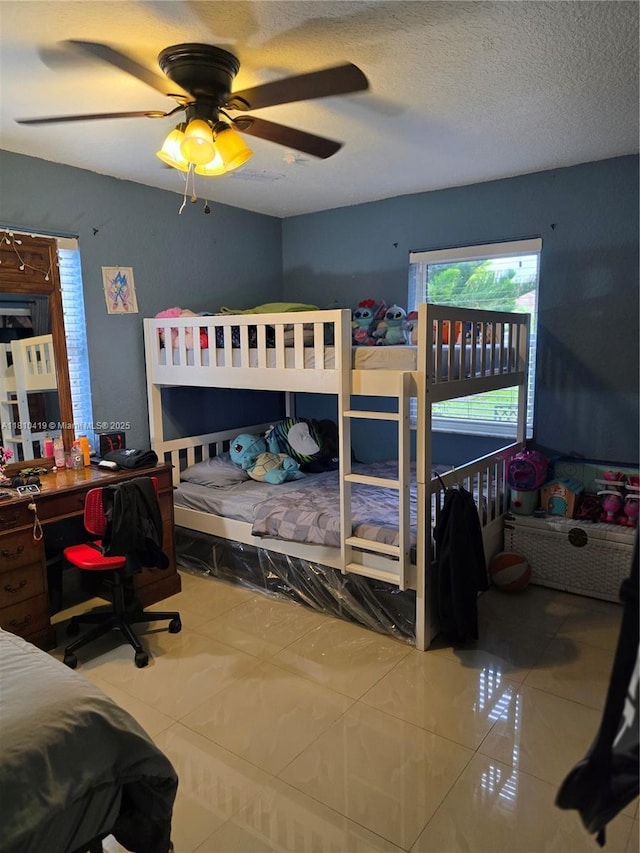 22374 SW 57th Cir, Boca Raton, FL 33428 - tiled bedroom featuring ceiling fan and a textured ceiling