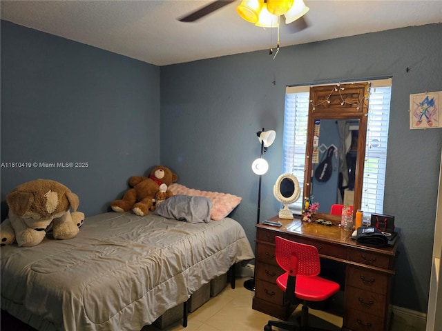 22374 SW 57th Cir, Boca Raton, FL 33428 - bedroom featuring ceiling fan and tile patterned floors