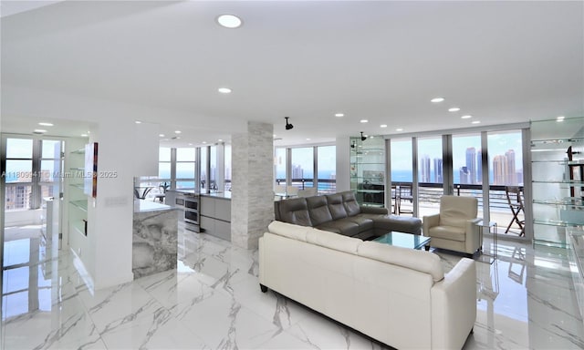 3500 Mystic Pointe Dr Unit 3906, Aventura, FL 33180 - living area featuring recessed lighting, plenty of natural light, french doors, and light marble finish flooring