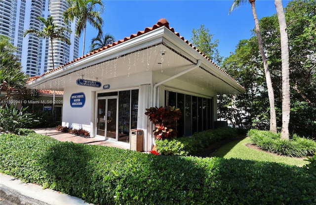 3500 Mystic Pointe Dr Unit 3906, Aventura, FL 33180 - rear view of property with a tile roof