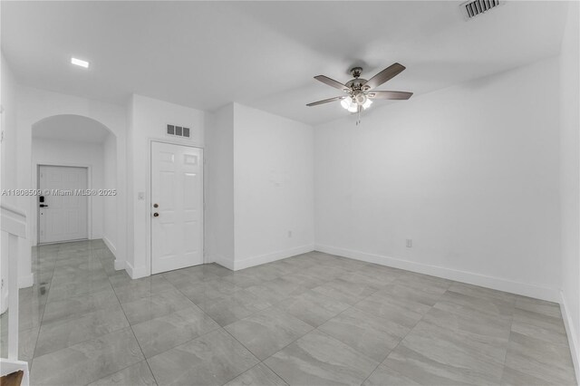9285 SW 220th Ter, Cutler Bay, FL 33190 - unfurnished room featuring arched walkways and a ceiling fan