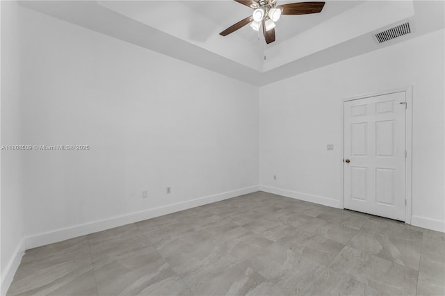9285 SW 220th Ter, Cutler Bay, FL 33190 - empty room featuring a ceiling fan and a raised ceiling