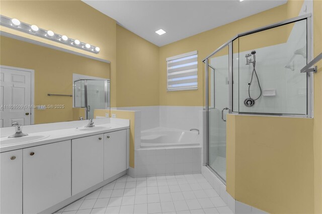 9285 SW 220th Ter, Cutler Bay, FL 33190 - bathroom featuring a stall shower, a garden tub, double vanity, and tile patterned flooring
