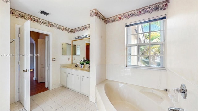 15141 SW 46th St, Miramar, FL 33027 - full bath featuring plenty of natural light, a garden tub, vanity, and tile patterned flooring