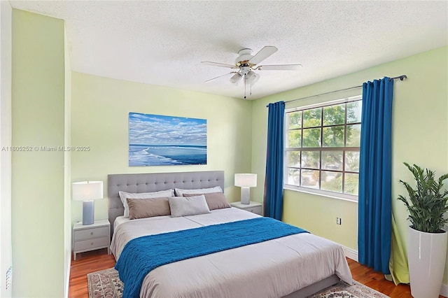 15141 SW 46th St, Miramar, FL 33027 - bedroom with a textured ceiling, wood finished floors, and ceiling fan