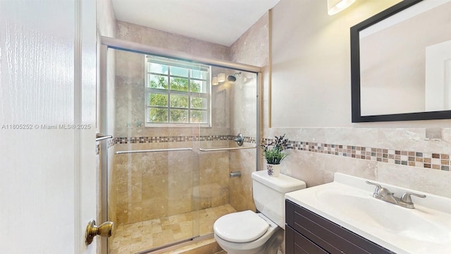 15141 SW 46th St, Miramar, FL 33027 - bathroom with tile walls, a stall shower, vanity, and wainscoting