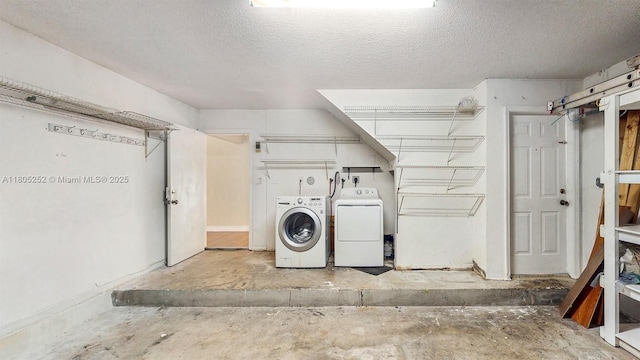 15141 SW 46th St, Miramar, FL 33027 - washroom with separate washer and dryer and a textured ceiling