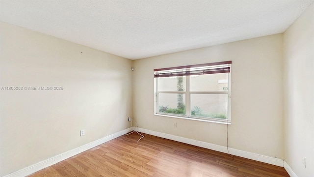 15141 SW 46th St, Miramar, FL 33027 - empty room with wood finished floors and baseboards