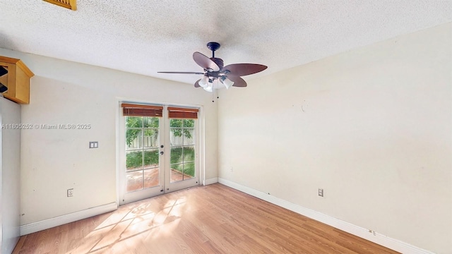 15141 SW 46th St, Miramar, FL 33027 - unfurnished room featuring light wood finished floors, french doors, a textured ceiling, and ceiling fan