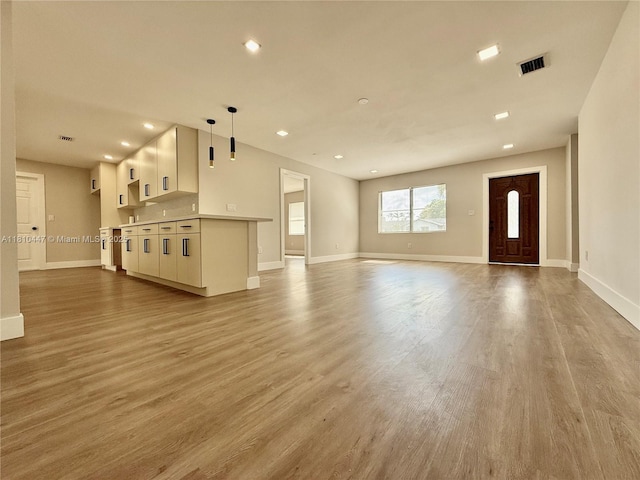 5506 SW 134th Pl, Miami, FL 33175 - unfurnished living room with wood finished floors, baseboards, and recessed lighting