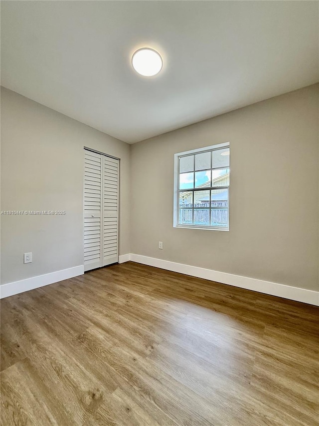 5506 SW 134th Pl, Miami, FL 33175 - unfurnished room with baseboards and wood finished floors