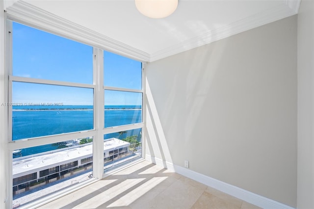 1901 Brickell Ave Unit B1114, Miami, FL 33129 - spare room featuring a water view, ornamental molding, and tile patterned floors