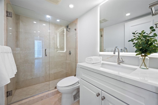 1901 Brickell Ave Unit B1114, Miami, FL 33129 - bathroom featuring vanity, a shower stall, recessed lighting, toilet, and tile patterned flooring