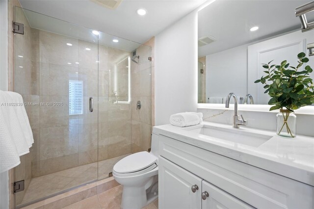 1901 Brickell Ave Unit B1114, Miami, FL 33129 - bathroom featuring vanity, a stall shower, recessed lighting, and tile patterned floors