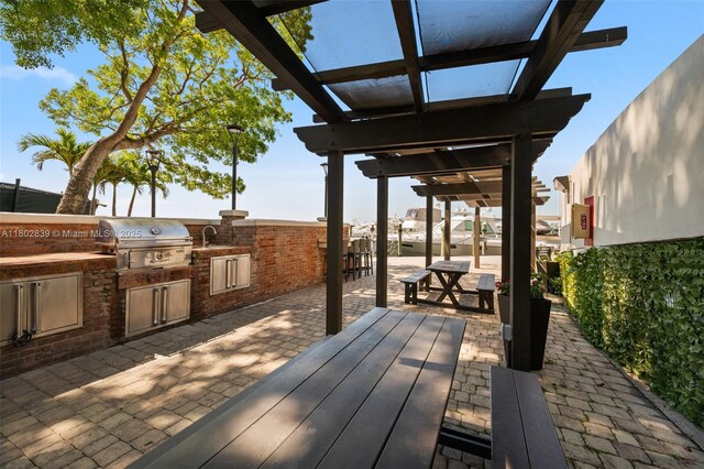 1901 Brickell Ave Unit B1114, Miami, FL 33129 - deck featuring an outdoor kitchen, a patio, and a pergola