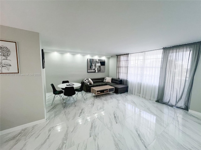 3725 S Ocean Dr Unit 425, Hollywood, FL 33019 - living area with baseboards and marble finish floors