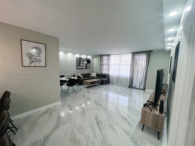 3725 S Ocean Dr Unit 425, Hollywood, FL 33019 - living room featuring baseboards and marble finish floors
