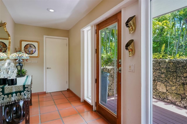 3169 Via Abitare Way Unit 6, Miami, FL 33133 - doorway featuring plenty of natural light, light tile patterned floors, and baseboards