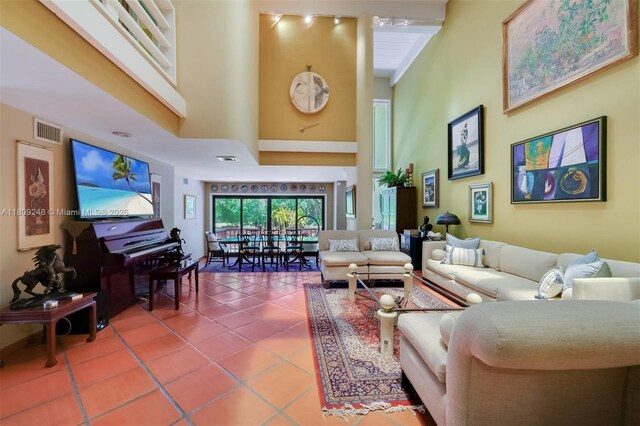 3169 Via Abitare Way Unit 6, Miami, FL 33133 - living room with a high ceiling and tile patterned floors