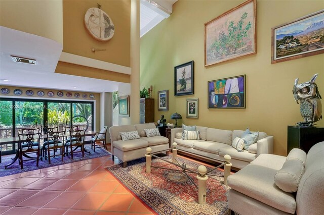 3169 Via Abitare Way Unit 6, Miami, FL 33133 - tiled living room featuring a towering ceiling