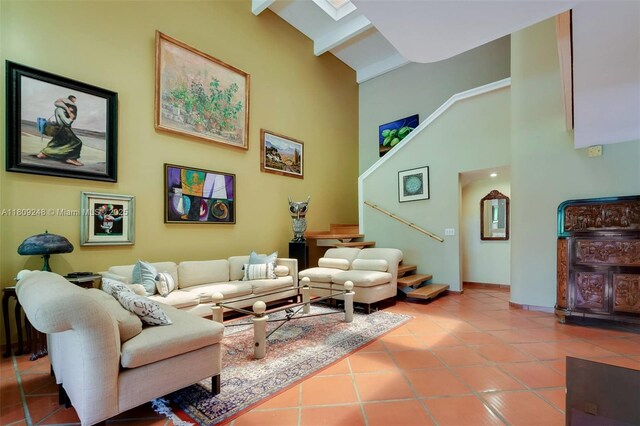 3169 Via Abitare Way Unit 6, Miami, FL 33133 - tiled living area with high vaulted ceiling, beamed ceiling, stairway, and baseboards