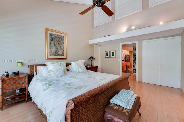 3169 Via Abitare Way Unit 6, Miami, FL 33133 - bedroom featuring light wood-style flooring, a towering ceiling, a closet, and ceiling fan