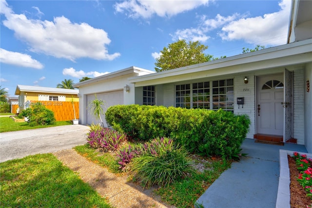 7211 Plantation Blvd, Miramar, FL 33023 - ranch-style home featuring a garage and driveway