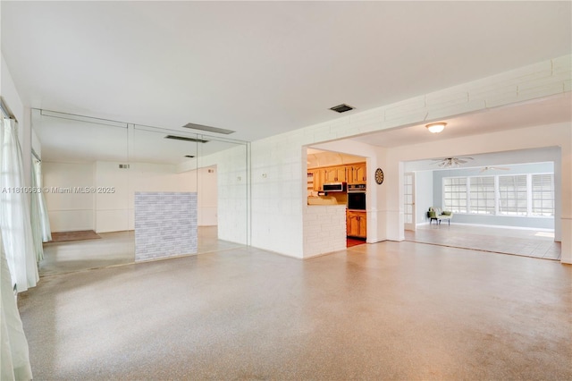 7211 Plantation Blvd, Miramar, FL 33023 - unfurnished living room featuring ceiling fan and speckled floor