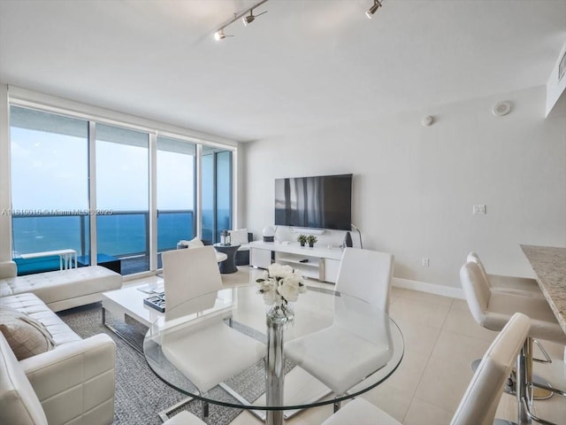 1830 S Ocean Dr Unit 5009, Hallandale Beach, FL 33009 - dining room featuring track lighting, baseboards, and light tile patterned flooring