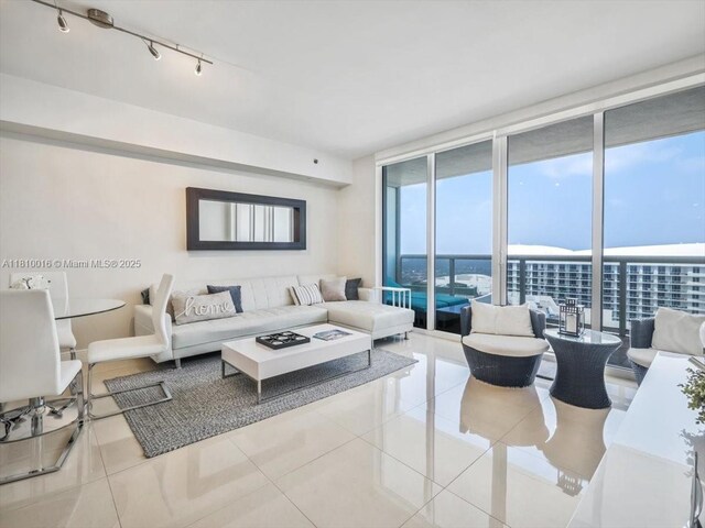 1830 S Ocean Dr Unit 5009, Hallandale Beach, FL 33009 - living room with expansive windows, tile patterned flooring, and rail lighting