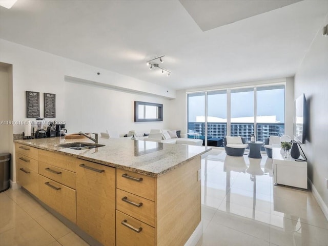 1830 S Ocean Dr Unit 5009, Hallandale Beach, FL 33009 - kitchen with a sink, light tile patterned flooring, light stone counters, a peninsula, and light brown cabinets
