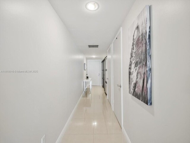 1830 S Ocean Dr Unit 5009, Hallandale Beach, FL 33009 - hallway featuring light tile patterned floors and baseboards