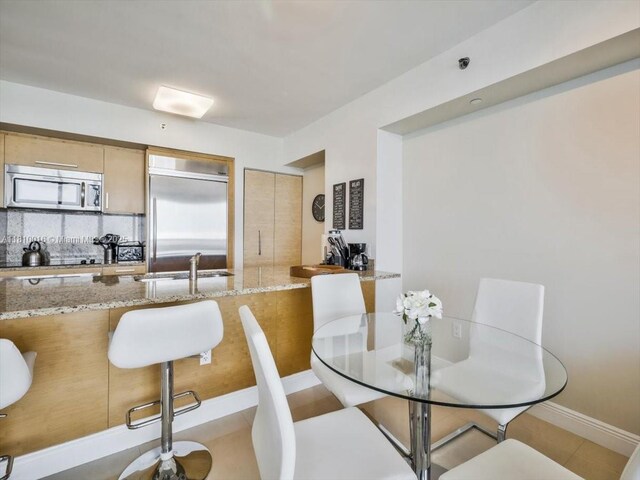 1830 S Ocean Dr Unit 5009, Hallandale Beach, FL 33009 - dining area featuring baseboards