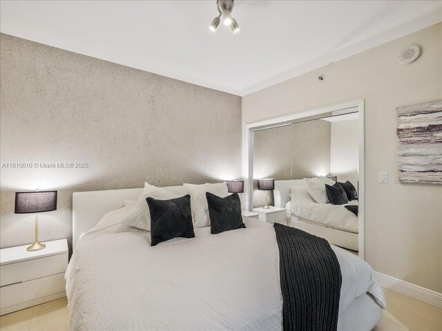 1830 S Ocean Dr Unit 5009, Hallandale Beach, FL 33009 - bedroom with light tile patterned floors and baseboards
