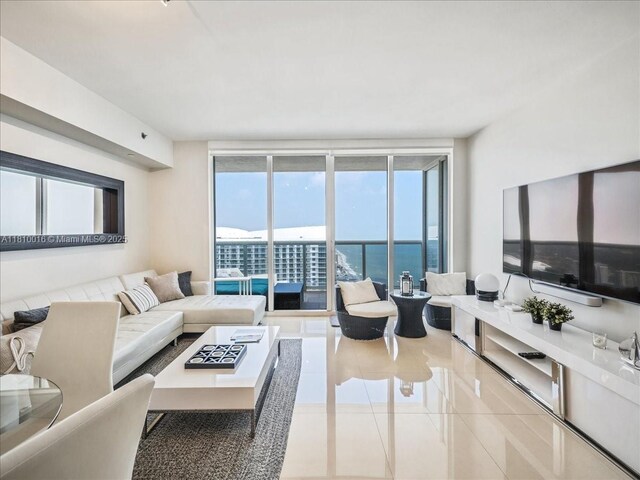1830 S Ocean Dr Unit 5009, Hallandale Beach, FL 33009 - living area with expansive windows and tile patterned flooring