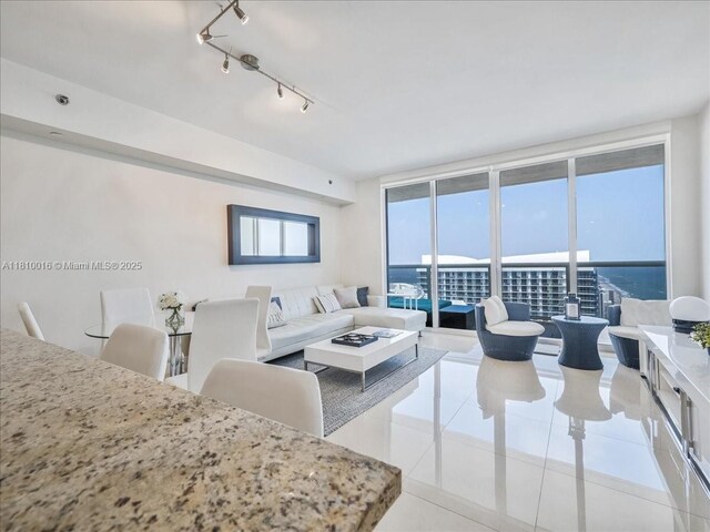 1830 S Ocean Dr Unit 5009, Hallandale Beach, FL 33009 - living room with light tile patterned flooring and expansive windows