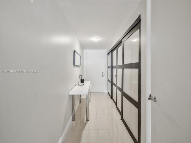 1830 S Ocean Dr Unit 5009, Hallandale Beach, FL 33009 - corridor featuring baseboards and light tile patterned floors