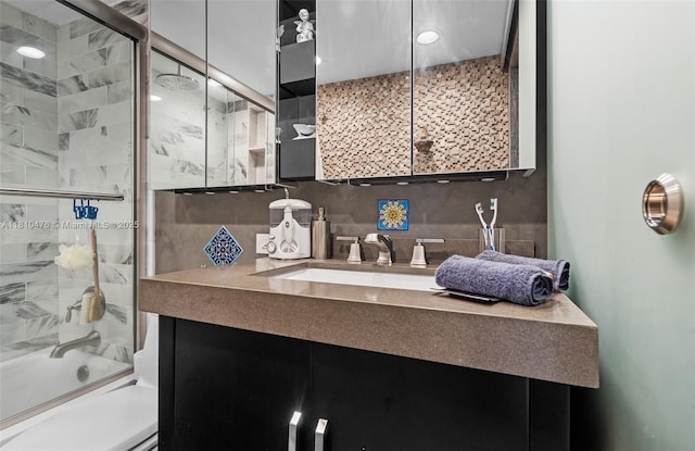 1985 S Ocean Dr Unit 17D, Hallandale Beach, FL 33009 - full bath featuring vanity, backsplash, and bath / shower combo with glass door