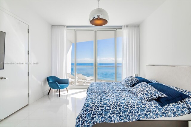 16901 Collins Ave Unit 2504, Sunny Isles Beach, FL 33160 - tiled bedroom featuring access to outside, a water view, and a wall of windows