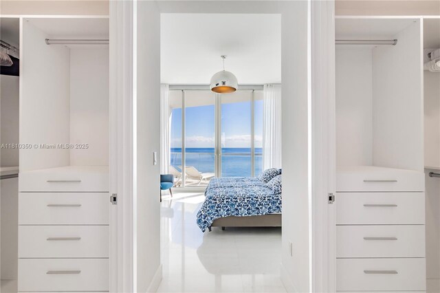 16901 Collins Ave Unit 2504, Sunny Isles Beach, FL 33160 - tiled bedroom with a water view, floor to ceiling windows, and access to exterior