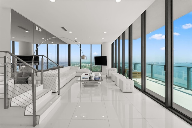3131 NE 7th Ave Unit Uph5303, Miami, FL 33137 - living room featuring floor to ceiling windows and tile patterned floors