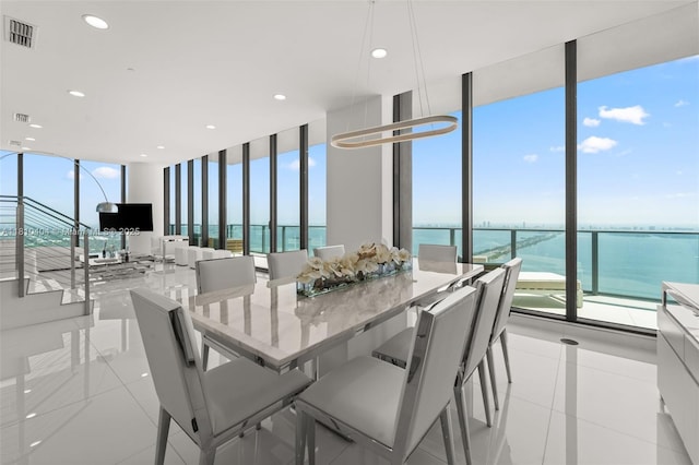 3131 NE 7th Ave Unit Uph5303, Miami, FL 33137 - dining room featuring expansive windows, light tile patterned floors, and recessed lighting