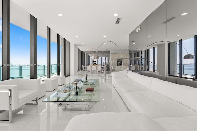 3131 NE 7th Ave Unit Uph5303, Miami, FL 33137 - tiled living room featuring a water view, healthy amount of natural light, recessed lighting, and a wall of windows