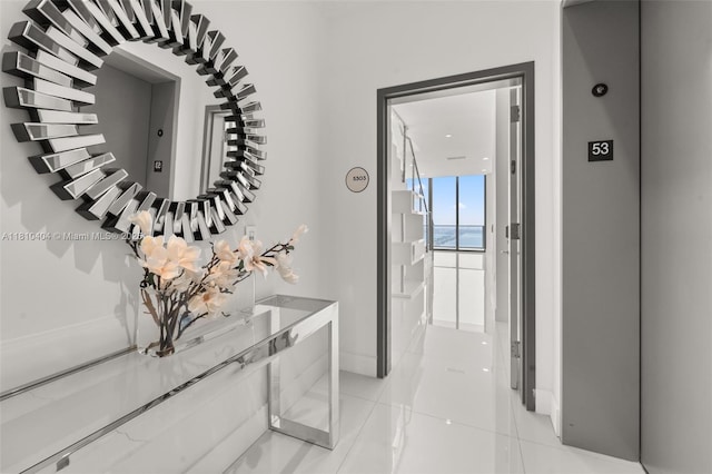 3131 NE 7th Ave Unit Uph5303, Miami, FL 33137 - corridor featuring light tile patterned floors and baseboards