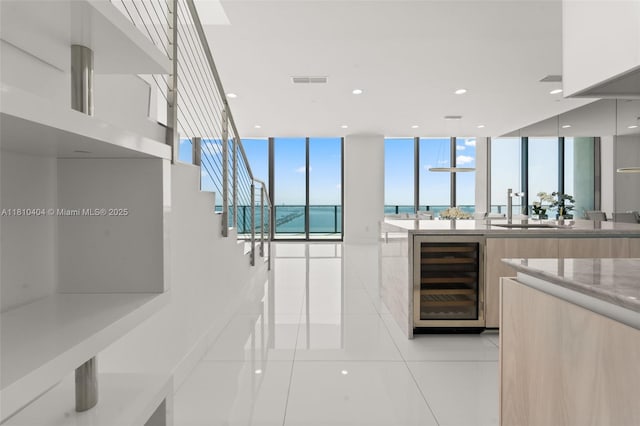 3131 NE 7th Ave Unit Uph5303, Miami, FL 33137 - full bathroom featuring wine cooler, tile patterned floors, vanity, a water view, and recessed lighting