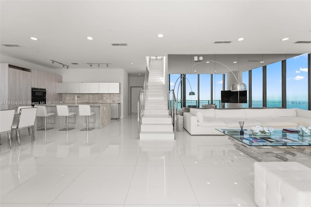3131 NE 7th Ave Unit Uph5303, Miami, FL 33137 - living room with light tile patterned floors, plenty of natural light, and recessed lighting