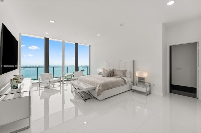 3131 NE 7th Ave Unit Uph5303, Miami, FL 33137 - tiled bedroom featuring floor to ceiling windows, a water view, and recessed lighting