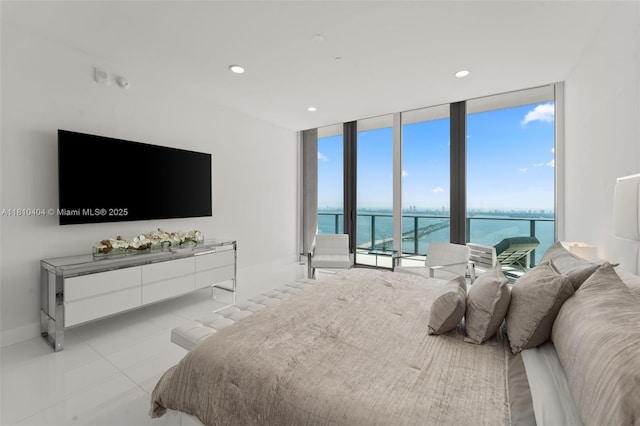 3131 NE 7th Ave Unit Uph5303, Miami, FL 33137 - bedroom featuring a wall of windows, light tile patterned floors, recessed lighting, access to outside, and baseboards