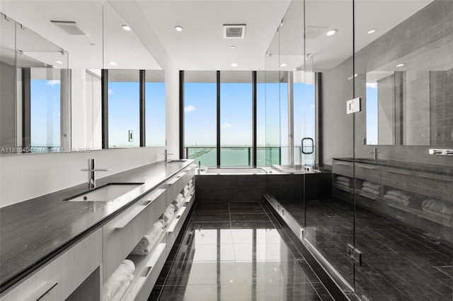 3131 NE 7th Ave Unit Uph5303, Miami, FL 33137 - full bath featuring a water view, double vanity, a stall shower, recessed lighting, and tile patterned flooring