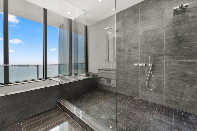 3131 NE 7th Ave Unit Uph5303, Miami, FL 33137 - full bath with a shower stall, a water view, and recessed lighting